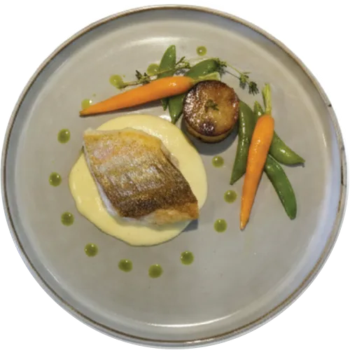 Linefish on a beurre blanc with carrots and peas
